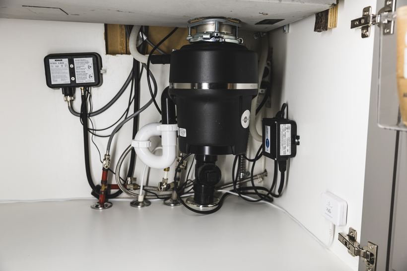 PuzL Detect beside the disposal and supply plumbing under a sink